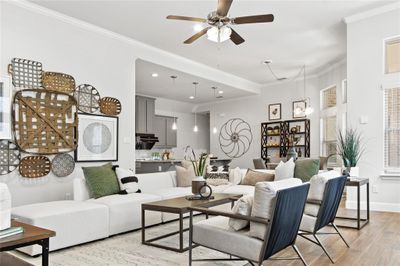 Living room featuring ceiling fan, light hardwood / wood-style flooring, and ornamental molding | Image 3