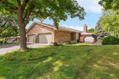 Discover this beautifully maintained end unit townhome, perfectly situated on Ithaca Lane in the highly sought-after Wayzata School District. Offering a blend of privacy, space, and convenience, this home is an exceptional find in a prime location. | Image 2