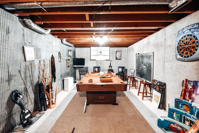 The other side of the room has been utilitized as a game room! With a little more work this area could be finished off- however very functional as it is set up now. Enjoy! | Image 21