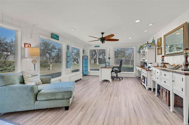 Office area with a ceiling fan, light wood-style floors, ornamental molding, and recessed lighting | Image 10