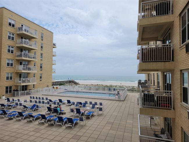 Community Pool Deck Featuring a Water view As Well Direct access To Cabanas , Bathrooms And Beach Access | Image 11