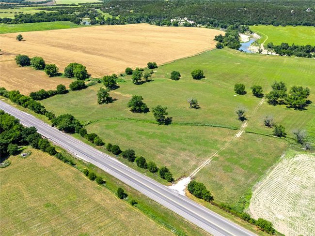 View of rural area featuring a nearby body of water | Image 15