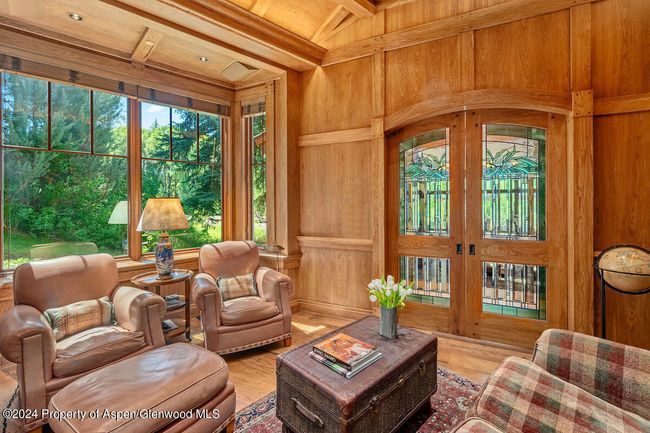 Spectacular custom beveled/stained glass doors provide library privacy. All the wood is hickory. Hear and see the river. | Image 16
