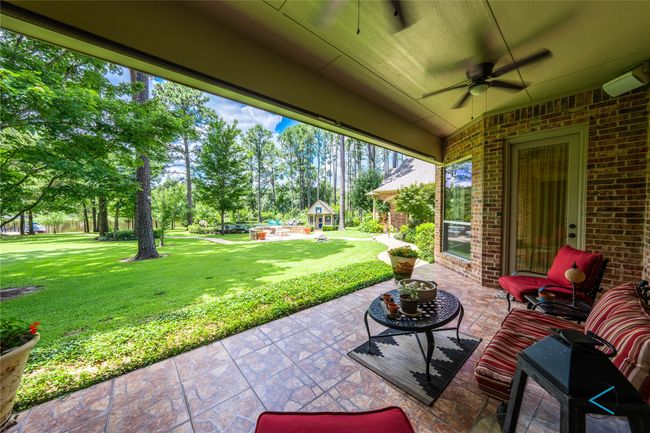View of patio featuring ceiling fan | Image 12