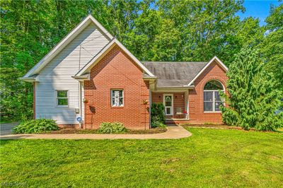 View of property featuring a front yard | Image 1