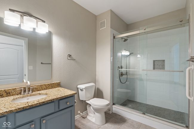 Updated bathroom includes new lighting, walk in shower, flooring, plumbing fixtures, toilet, 1/4 stop plumbing valves, and mirror | Image 33