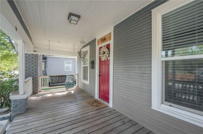 Deck featuring a porch and swing | Image 3