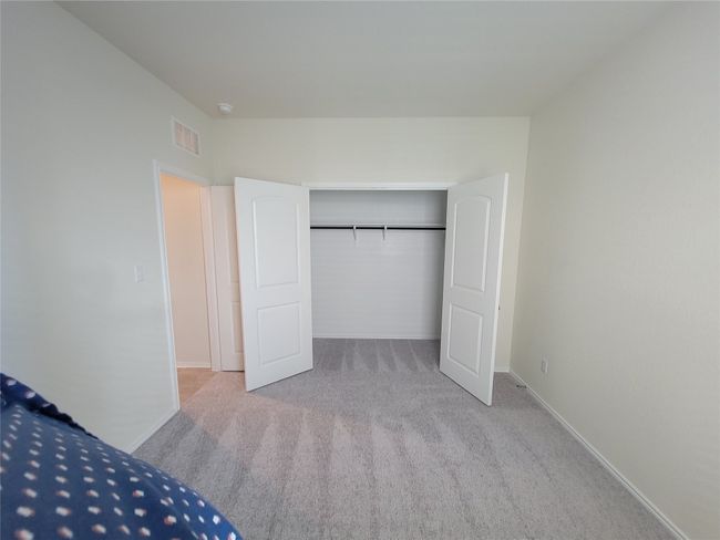 Unfurnished bedroom featuring carpet flooring, a closet, baseboards, and visible vents | Image 15