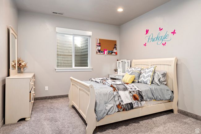 Bedroom featuring visible vents, baseboards, carpet, and recessed lighting | Image 35