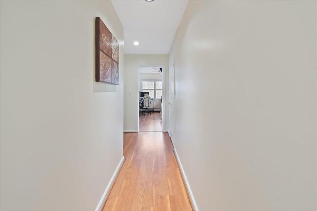 Hallway featuring baseboards, and light wood-type flooring | Image 21