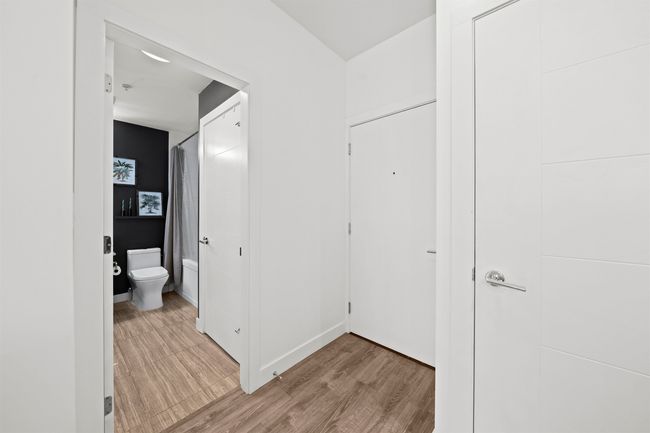 Corridor featuring light wood-style flooring and baseboards | Image 21