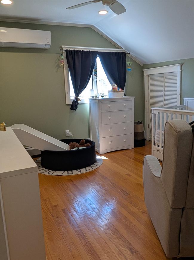 Bedroom with wood finished floors, and ceiling fan | Image 22