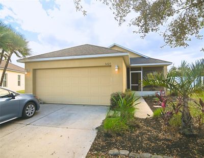 2 car garage and frontage of the home | Image 1