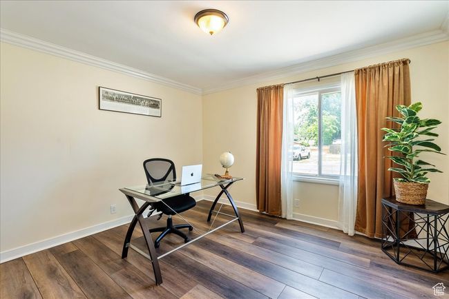 Home office with ornamental molding and dark wood-type flooring | Image 26