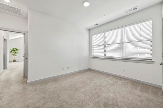 Spare room with light carpet | Image 32