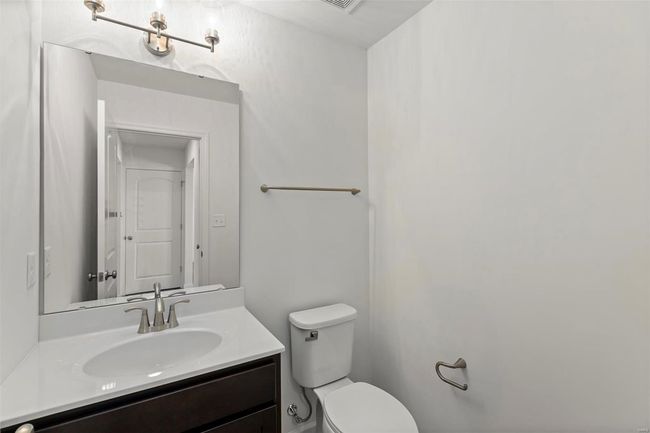 Bathroom featuring vanity and toilet | Image 20