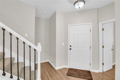 Entrance foyer with light hardwood / wood-style floors | Image 3