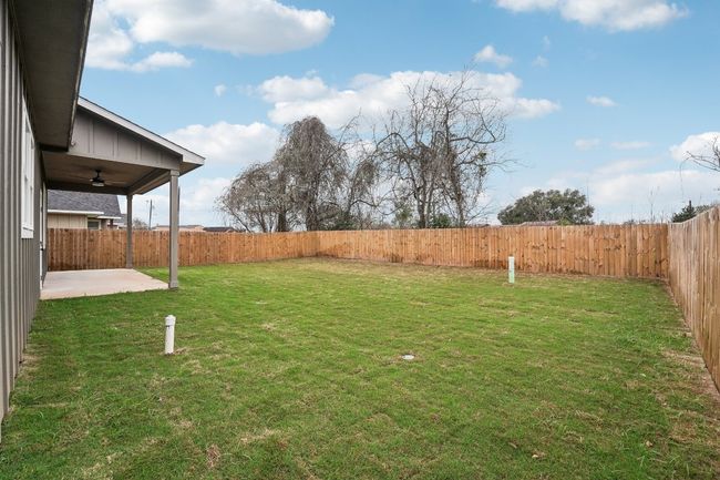 View of yard with a patio area, ceiling fan, and a fenced backyard | Image 36