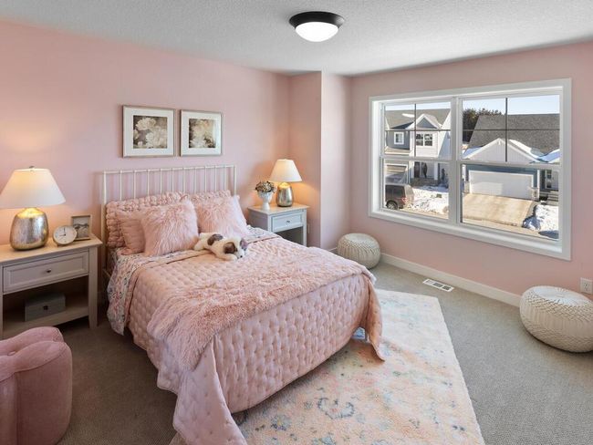 Bedroom 2 offers a cozy and comfortable 11x10 space, perfect for a guest room, home office, or a versatile retreat, designed to suit your needs with plenty of natural light. | Image 28