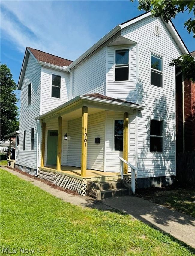 View of front of house with a front lawn and covered porch | Image 1