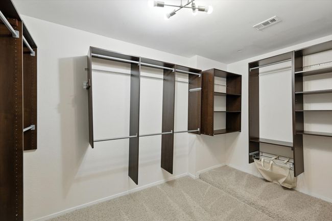 Spacious closet featuring carpet floors | Image 23