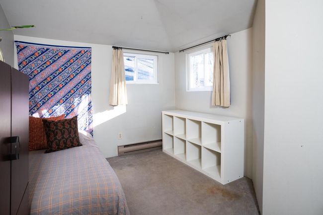 Carpeted bedroom featuring baseboard heating | Image 24
