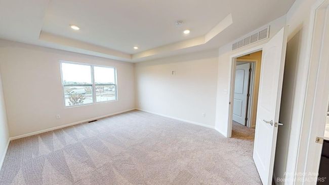 Upper level primary suite bedroom. | Image 16