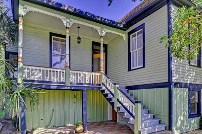 Stately East End 2/2 with a garage, an apartment, and storage space below the house. Blocks from the beach and the East End Historic District. | Image 1