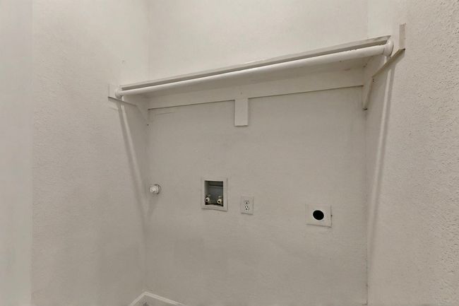 Washroom featuring electric dryer hookup, washer hookup, and gas dryer hookup | Image 15