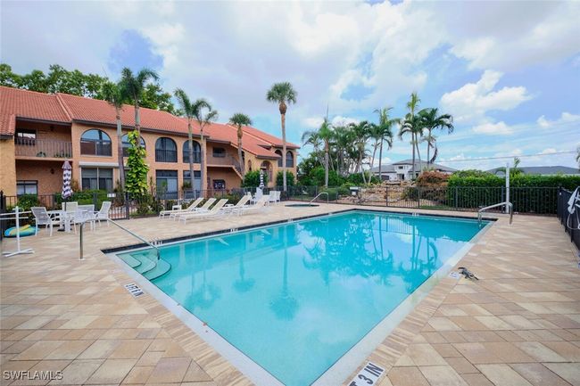 Community pool with a patio area | Image 33