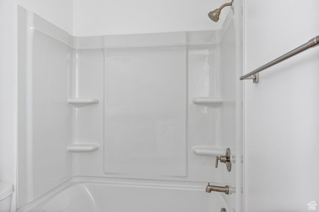 Bathroom with toilet and tub / shower combination | Image 22