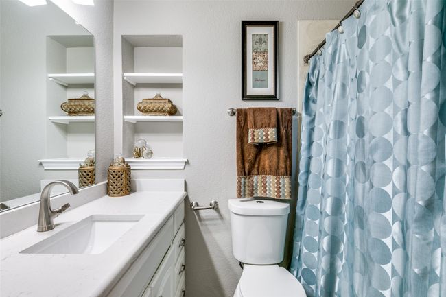 Second of 3 full size baths, this one is in hall. It does have a bathtub, cute little wall niche and a pocket door. | Image 16