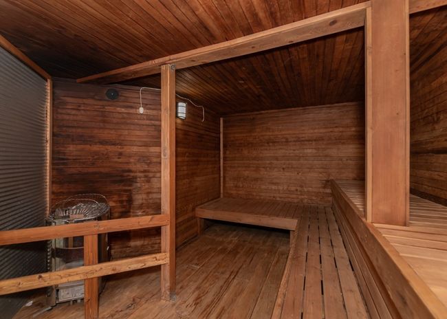 Sauna / steam room with wood ceiling, wood walls, and wood-type flooring | Image 19