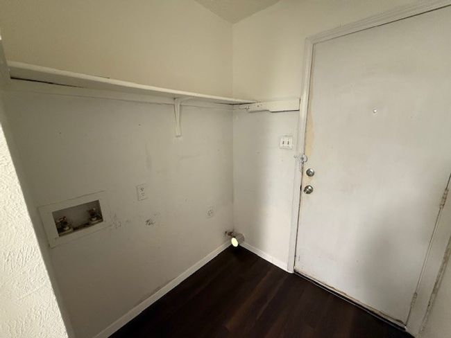 Washroom featuring hookup for a washing machine, dark wood-style flooring, and baseboards | Image 5