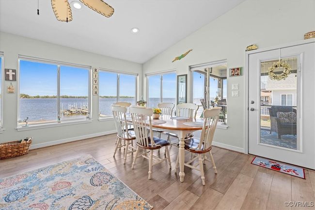 Dining area with recessed lighting, located off of the family room with door leading to screened porch - this home was meant for major entertaining!!! | Image 13