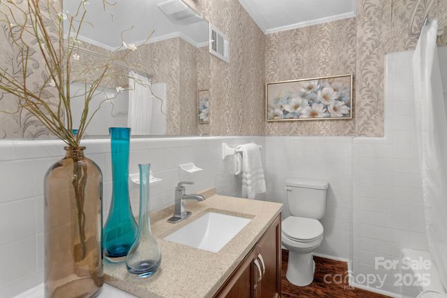 Full bath with tile wall detail and shower/tub combination | Image 20