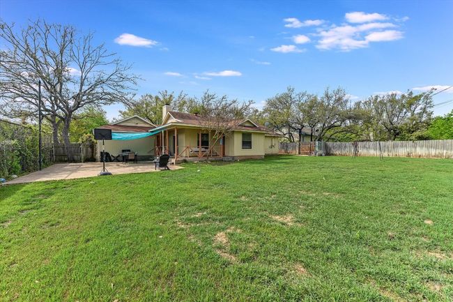 View of yard with a patio and a fenced backyard | Image 23
