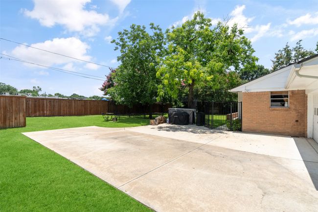 Tons and tons of parking room plus an area for ride-on toys or a future site for a basketball goal! | Image 29