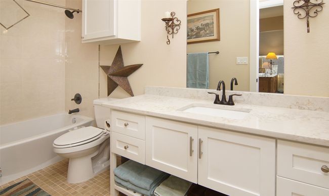 Full bath with vanity, shower / tub combination, and tile patterned floors | Image 19