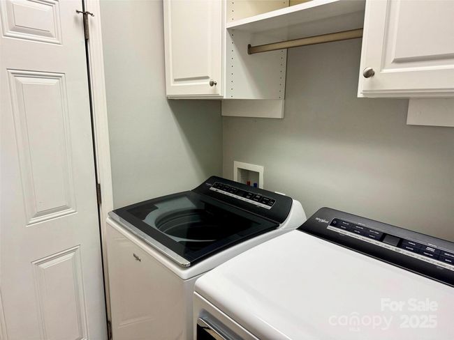 Main-level laundry (door to garage on left) | Image 18