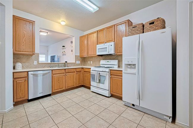 Kitchen opens up to the large living space making cooking and entertaining a breeze. | Image 13