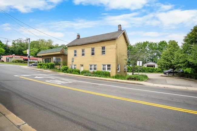 View of front of property featuring a chimney | Image 23