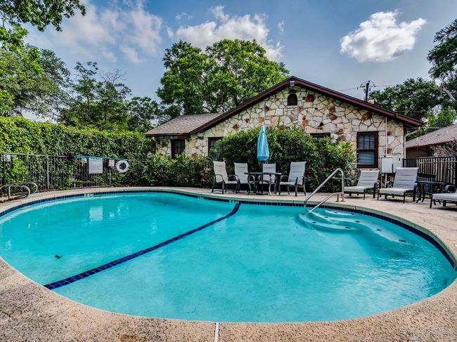 Community pool with a patio | Image 15