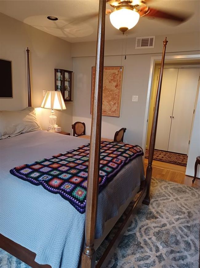 Standing inside the bedroom, looking out toward the vanity, hallway and water closet. | Image 20