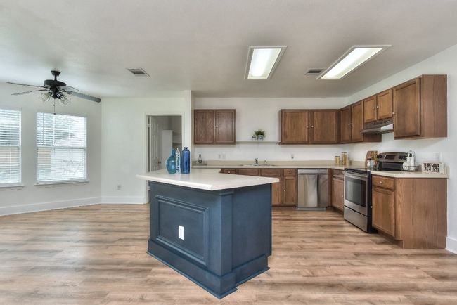 Center island has plenty of room to add some stools for additional dining and entertaining space! | Image 15