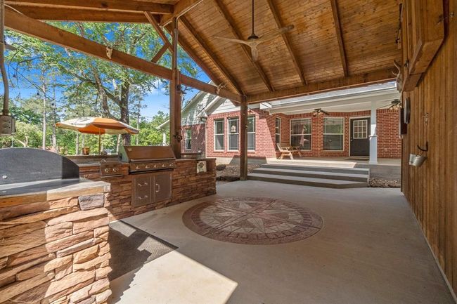 Great covered patio with outdoor kitchen for entertaining. | Image 9