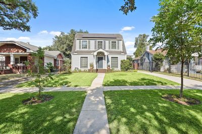 Spacious and landscaped front yard with mature trees offering shade and curb appeal. | Image 2