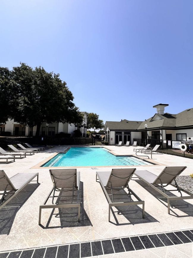 View of swimming pool featuring a patio | Image 5