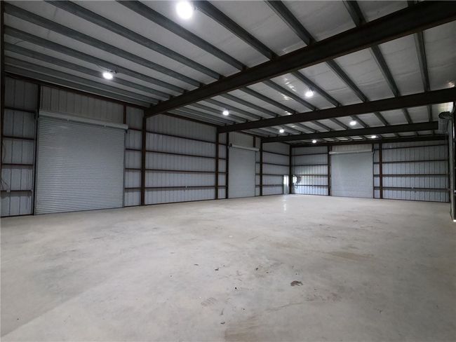 Garage featuring metal wall | Image 6