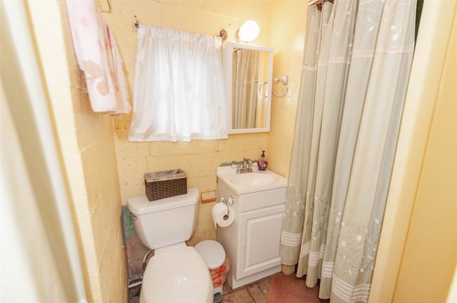 Bathroom with toilet and vanity | Image 21